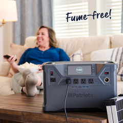 Woman sitting on couch with Patriot Power Generator 2000X plugged in. Fume-free!