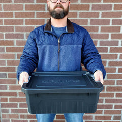 Man holding one Small Stackable Storage Tote