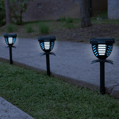 BugOUT Solar Stake Light lighting up an outdoor walkway