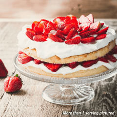 Sliced strawberries in a cake. More than one serving pictured.
