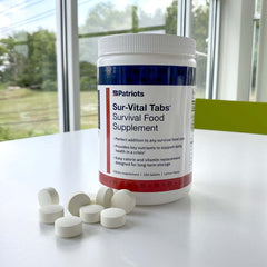 Sur-vital tabs survival food supplement sitting on a table.