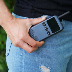 Person holding a Talk-N-Go Rechargeable Walkie Talkie