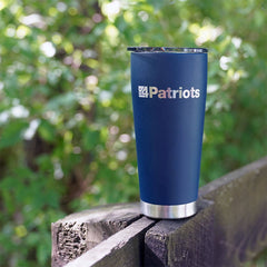 4Patriots stainless steel travel tumbler sitting on a fence outside