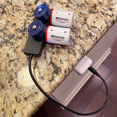 USB-Rechargeable D Battery Kit charging on the counter