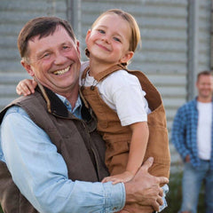 Man holding a girl smiling