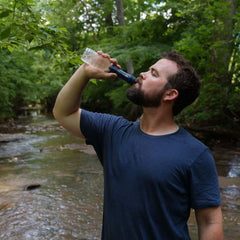 Man drinking water through the Patriot Pure Personal Water Filter